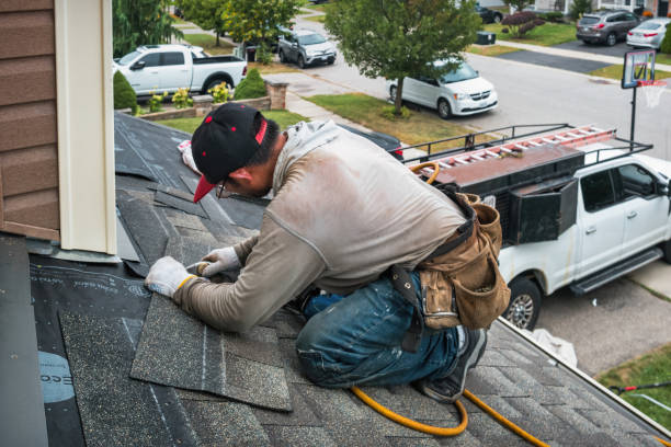 Professional Roof Replacement technician working in Brohard, WV